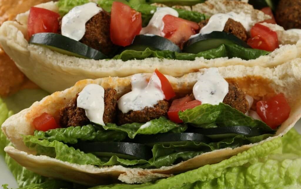 Pita bread filled with falafel, a Middle Eastern delicacy.
