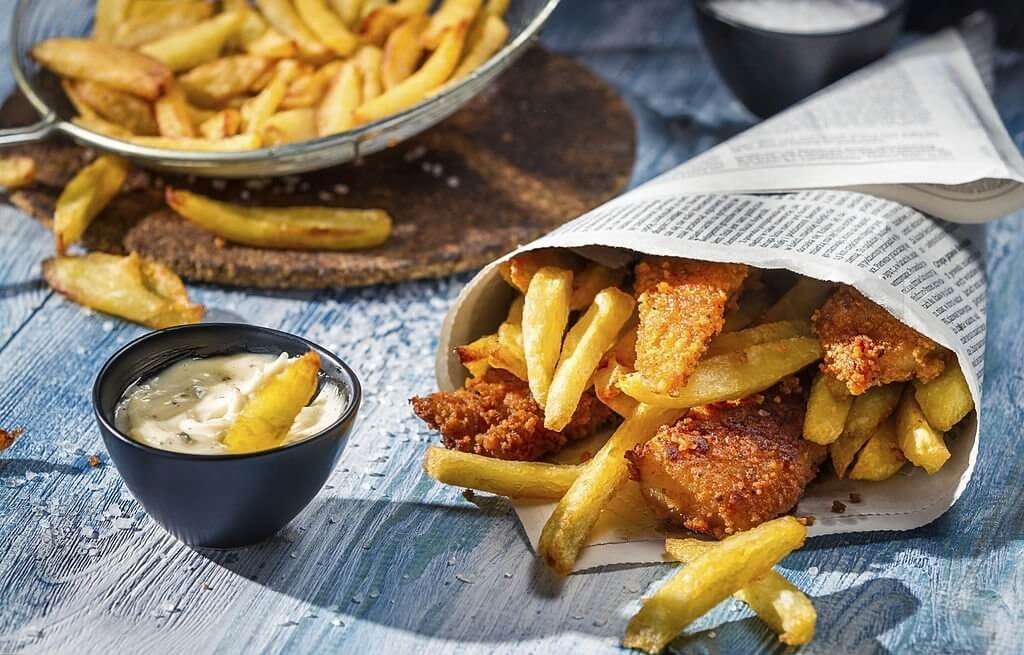 Traditional fish and chips served in a newspaper.